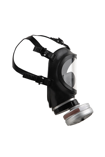 Modern black gas mask with a large transparent plastic visor. Protection against poisonous substances in the air. Isolate on a white background.