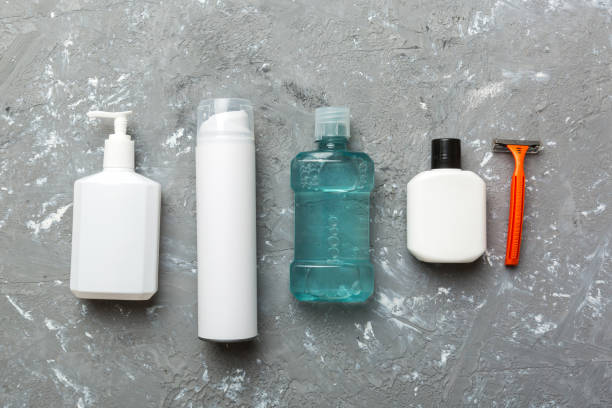 istock Mockup for bathing products top view flat lay, spa razor, toothpaste, soap, gel and other various accessories. Cosmetics for skin health. Bath Mockup for your logo 1441490694