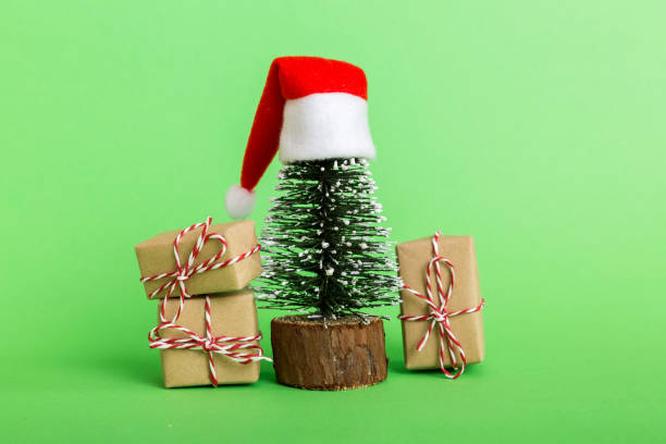 istock Christmas composition. Gifts, small tree, branches and craft DIY decorations on white background. New year concept. Christmas home decoration Flat lay, top view, copy space 1441490805