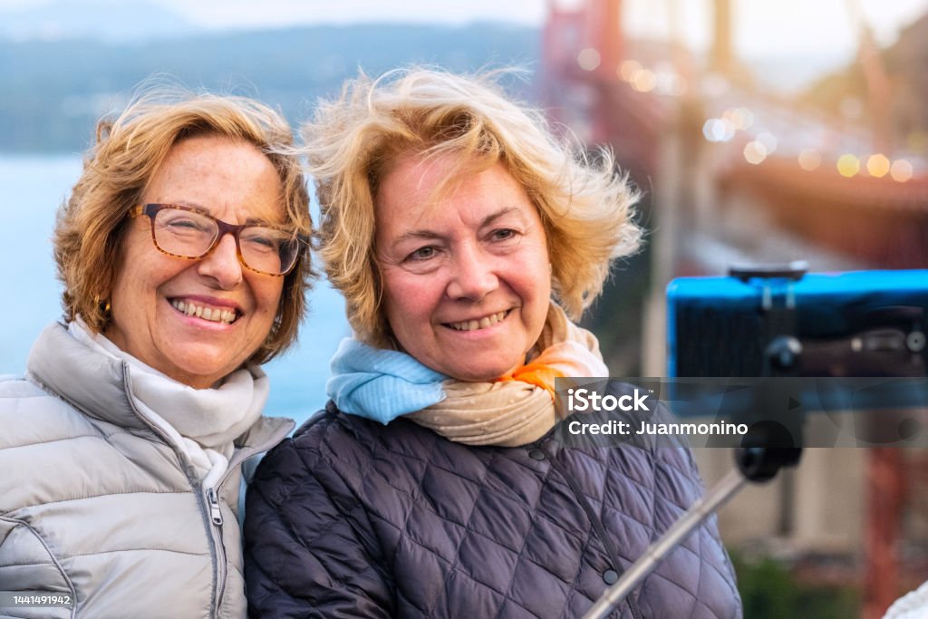 Smiling Happy Mature Senior Lesbian In A Honeymoon Journey Taking A