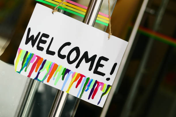 istock welcome hand written text on paper hanging on cafe door 1441493717