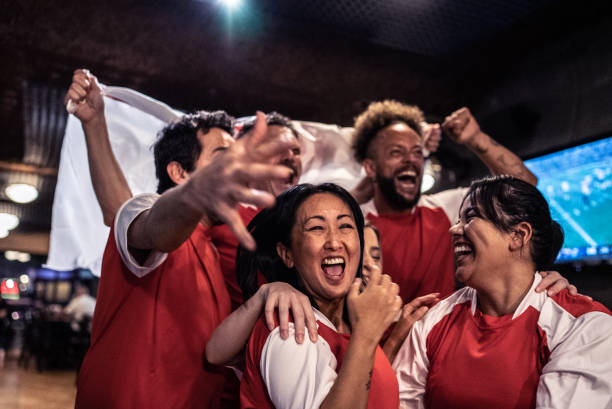 istock Friends rooting for their team and celebrating 1441493740