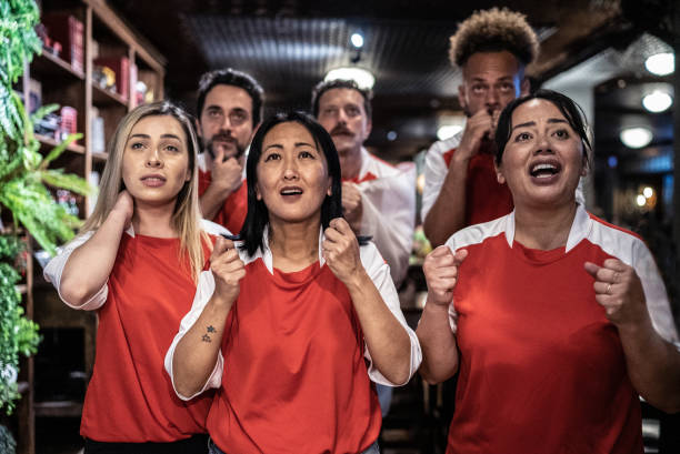 istock Group of friends rooting for their team 1441493757