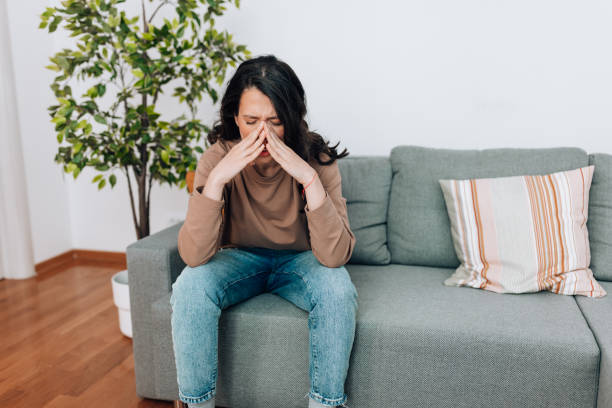 istock Stressed young Caucasian woman feeling headache 1441493906