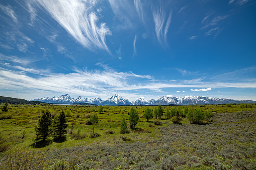 Wide shot of the Teton range and Grand Teton National Park in northwestern Wyoming USA. Nearby towns are Jackson, Wyoming, Denver, Colorado and Salt Lake City, Utah.