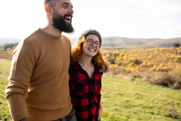 istock Happy couple having a walk in the meadow 1441497236