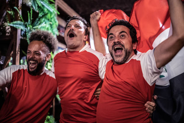 istock Friends rooting for their team and celebrating 1441498297