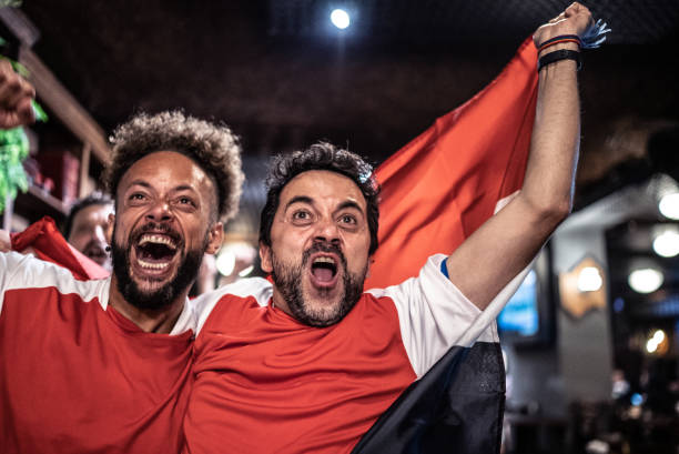 istock Friends rooting for their team and celebrating 1441498301