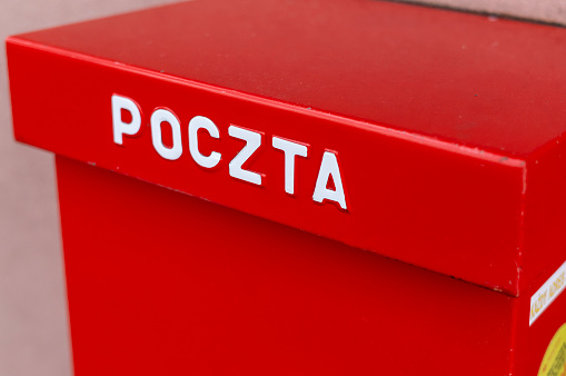 Red post box in Poland. Typical polish post symbol