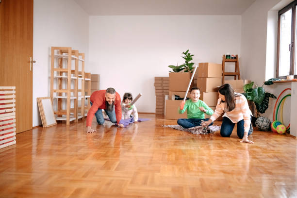 istock Kids playing with parents in new empty apartment 1441499845