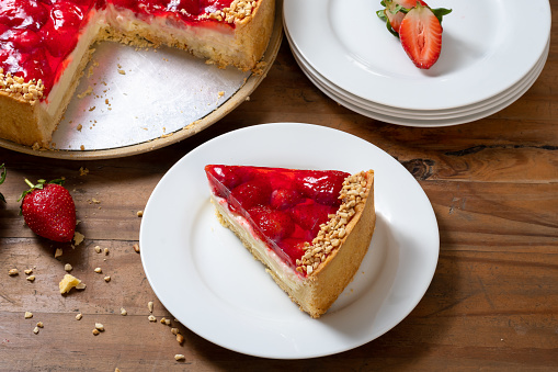 Strawberry Pie,  slice of pie on a white plate, wooden background