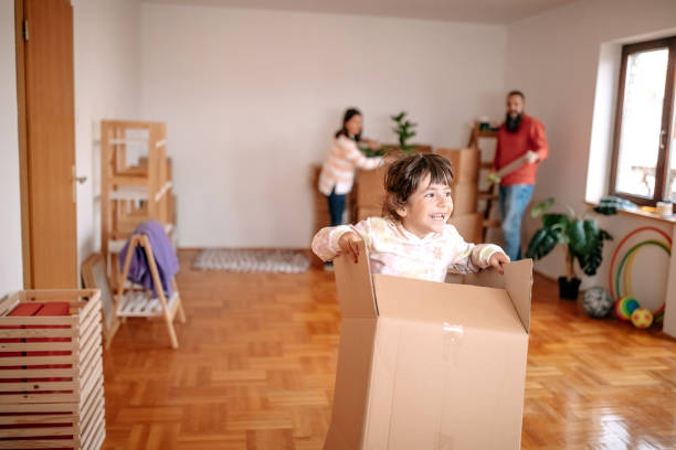 istock Kids playing with parents in new empty apartment 1441500861