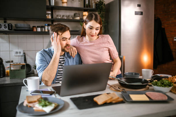 istock Young couple having breakfast in the kitchen in morning 1441502399