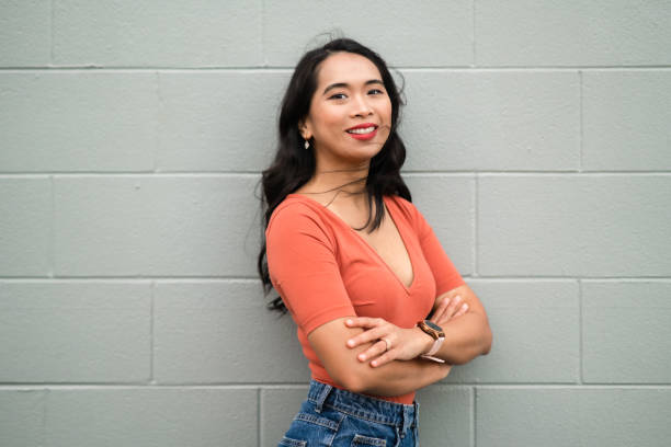 istock Asian woman posing against grey  background. 1441504881