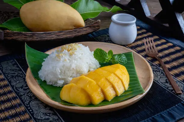 Photo of mango with sticky rice is popular traditional dessert of thailand.