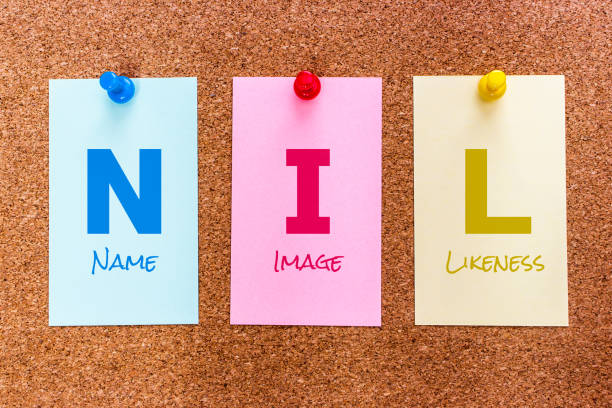 3 letters keyword NIL (Name, Image and Likeness) on multicolored stickers stock photo