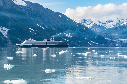 Glacier Bay, AK - September 5, 2022: Holland America cruise ship Nieuw Amsterdam sailing through the icy waters of  Glacier Bay, Alaska