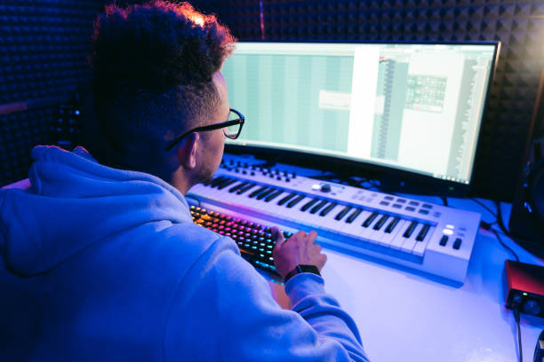 istock Young sound producer working at studio 1441512180