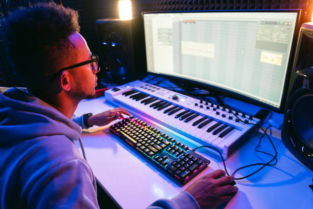 istock Young sound producer working at studio 1441512183