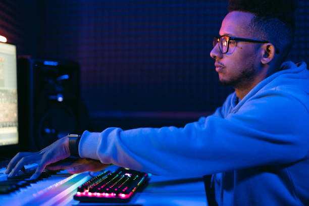istock Young sound producer working at studio 1441512185