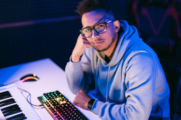Young sound producer working at studio stock photo