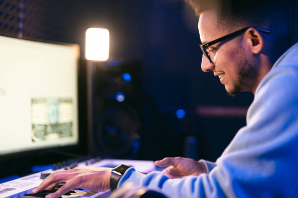 istock Young sound producer working at studio 1441512259