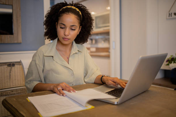 istock Young woman working from home 1441515624