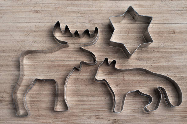 istock Wild animal cookie cutters on wood board. 1441515663