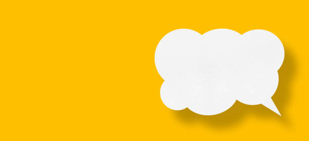 istock white cloud paper speech bubble on yellow background 1441522208