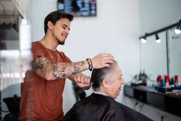 istock Barber cutting senior woman's hair 1441524591