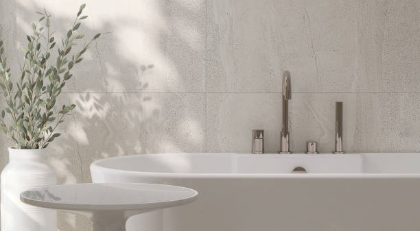 istock White ceramic side table by bathtub in luxury design bathroom and tropical tree with dappled sunlight from window and leaf shadow on granite tile wall 1441527385