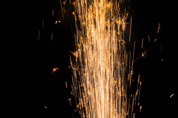 istock close up burning flare or flame with bright sparks and smoke on background with copy space. festive event concept. fireworks exploding at night. 1441531592