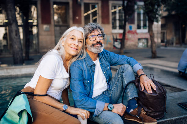 istock Mature couple on vacation taking a break while sightseeing 1441532015
