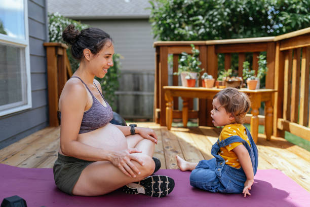 istock Happy mom and daughter exercising together outside 1441532339