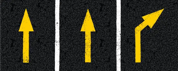 Vector illustration of Yellow directional arrow signs on tarmac road top view