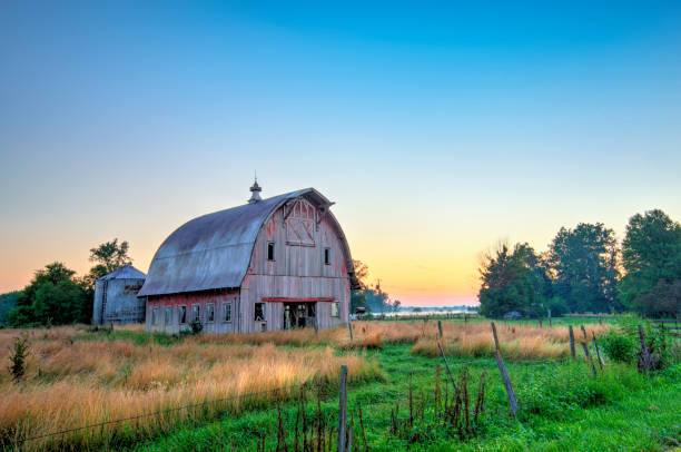 istock Old Weathered Red Barn at sunrise-Howard County, Indiana 1441533941
