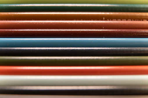 This is a photo of multiple Prismacolor pencils lined up horizontally across the photo.