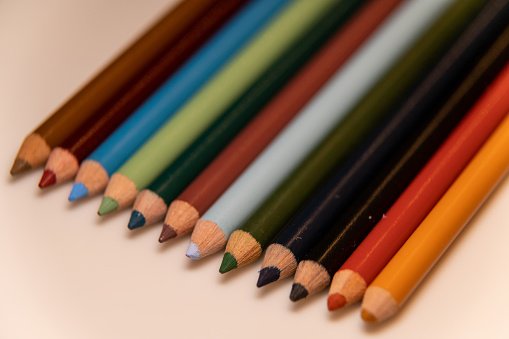 This is a photo of Prismacolor pencils arranged at an angle.  They are pointed towards the lower left corner and go off screen towards the upper right corner.