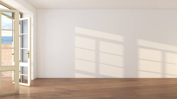 istock Sunny Beige Hotel Interior with Open Doors Overlooking the Beach 1441536271