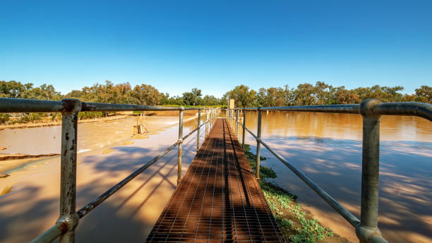 Allan Tannock Weir on the Warrego River south of Cunnamulla in Outback Queensland Cunnamulla Weir overflowing after a large rain event. queensland floods stock pictures, royalty-free photos & images