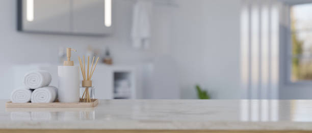 istock Copy space on white marble bathroom tabletop over blurred background of bathroom 1441541858