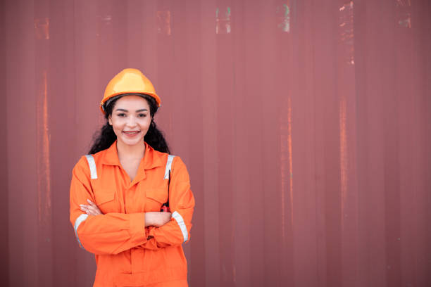 istock Portrait Engineer worker under working inspection and checking with radio communication ,file ducument container dock yard shipping dock yard logistics export import business concept. 1441545238