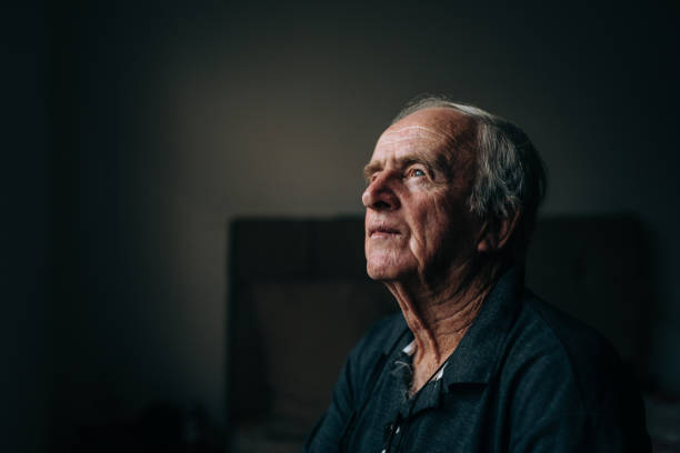 istock Contemplative elderly man at home 1441546101