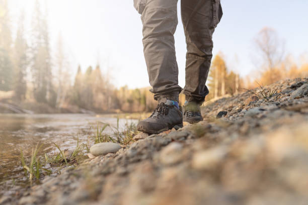 istock men's footsteps on the beach of river 1441547238
