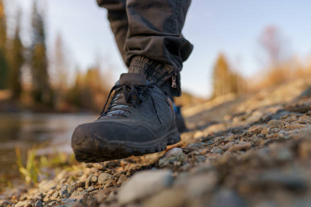 istock men's footsteps on the beach of river 1441547240