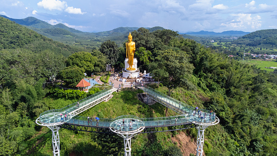 Aerial view of beautiful bridge or glass sky walk is new landmark viewpoint bettween Thailand and Laos PDR at Phra Yai Phu Khok Ngio Chiang Khan, Loei Province, Mekong river Thailand