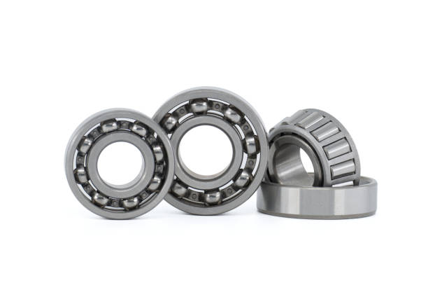 istock Set of various ball and roller bearings on white 1441552939