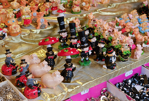Happy New Year! Close-up of lucky charms as sold in shops and market stalls in Austria in the days leading up to New Year's Eve. The most popular lucky charms include chimney sweeps, pigs, toadstools, horseshoes and shamrocks.