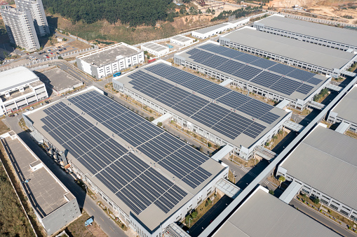 Power plant using renewable solar energy with blue sky.