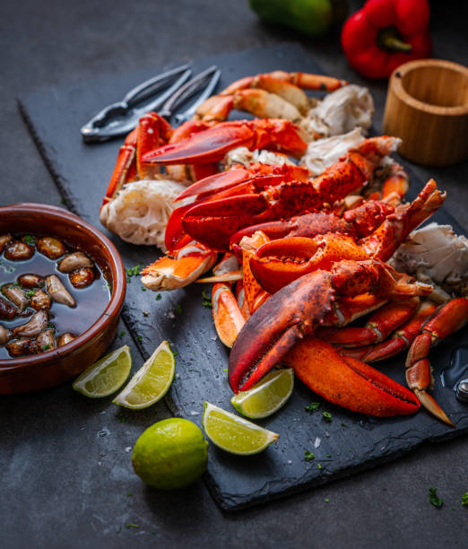istock Lobster claws and Dungeness crab legs ready to eat 1441559177